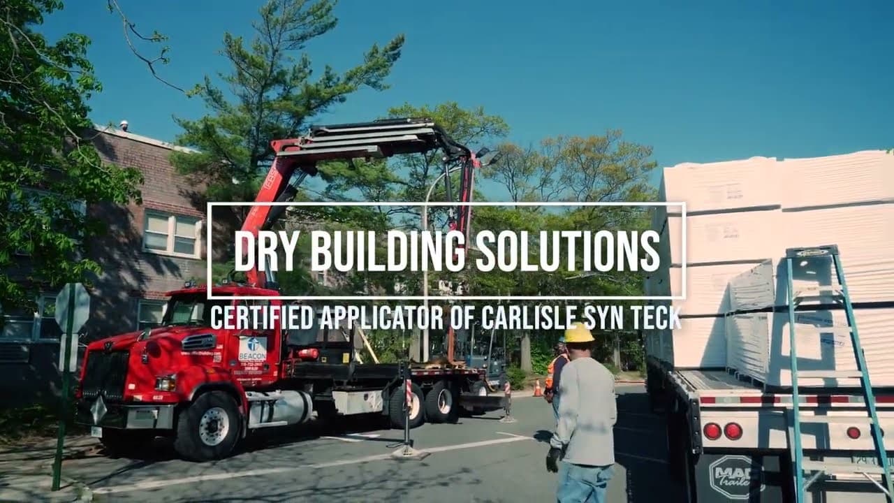 Materials being craned in at the start of a roof renovation, filmed for Dry Building Solutions
