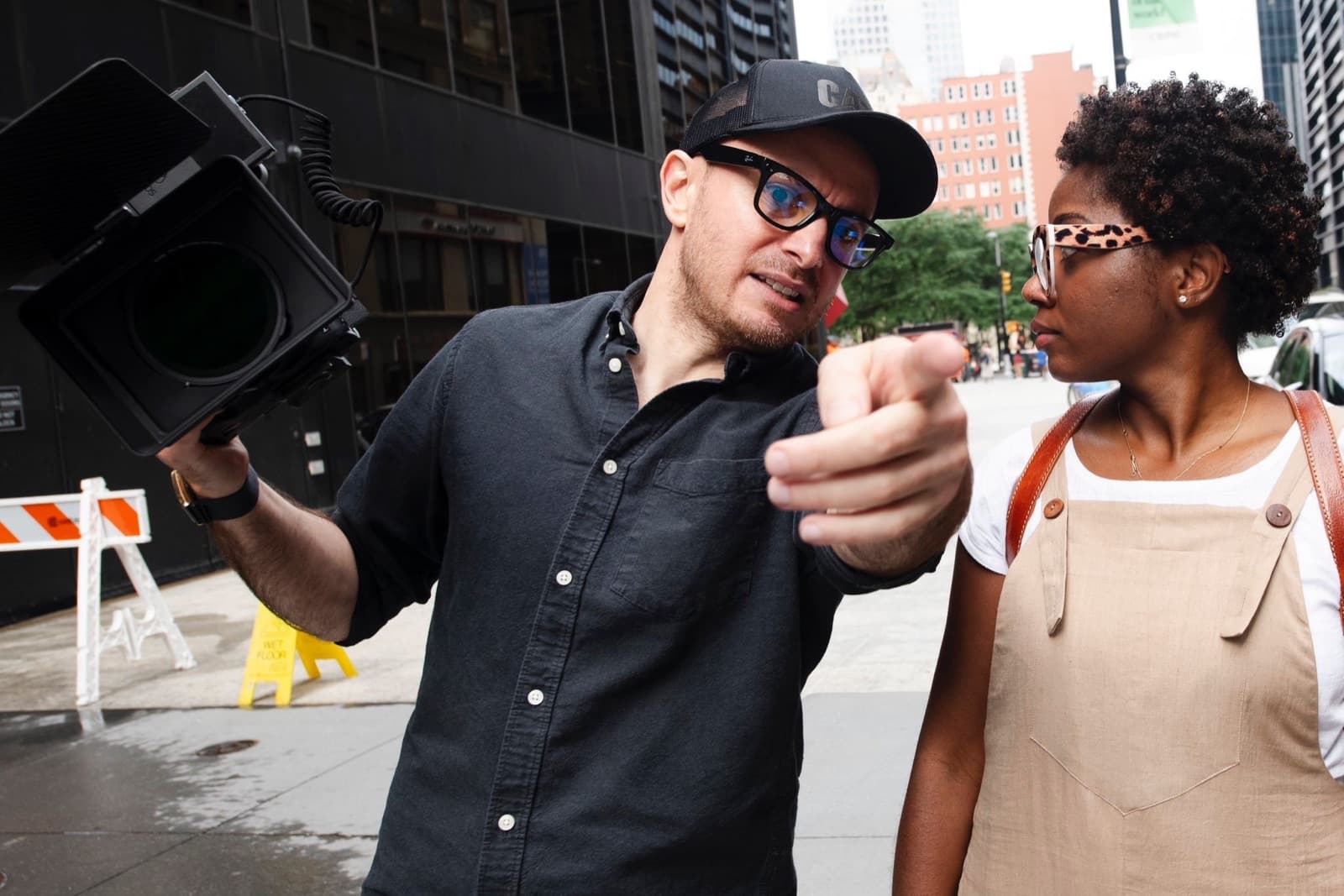 Beka Virtue with a camera, directing on location