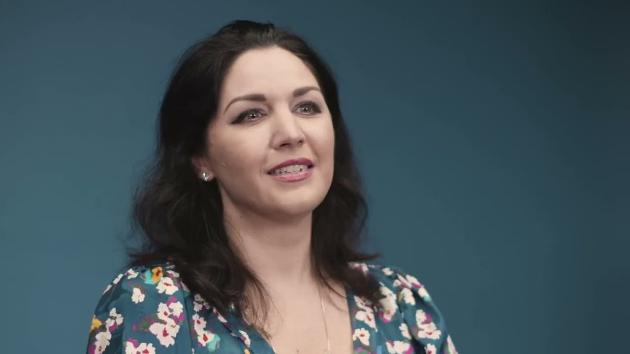 A UNICEF interview subject filmed against a plain studio backdrop